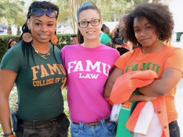 Three female law students at event