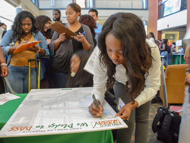 Law student signing document